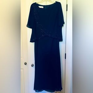 A-line scoop neck floor length chiffon dress with beading.